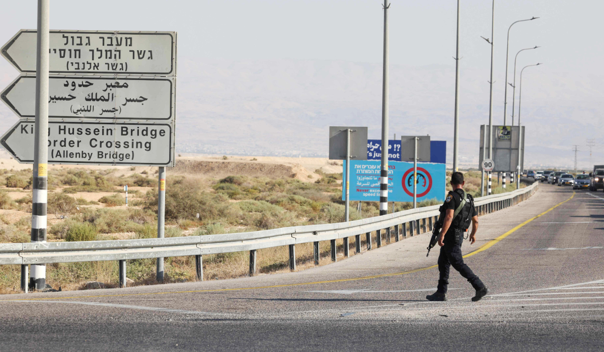 Cars queue as Israeli police closes off a road leading to the Allenby bridge, the main border crossing between the Israel-occupied West Bank and Jordan, following a shooting attack on September 18, 2025. (AFP)