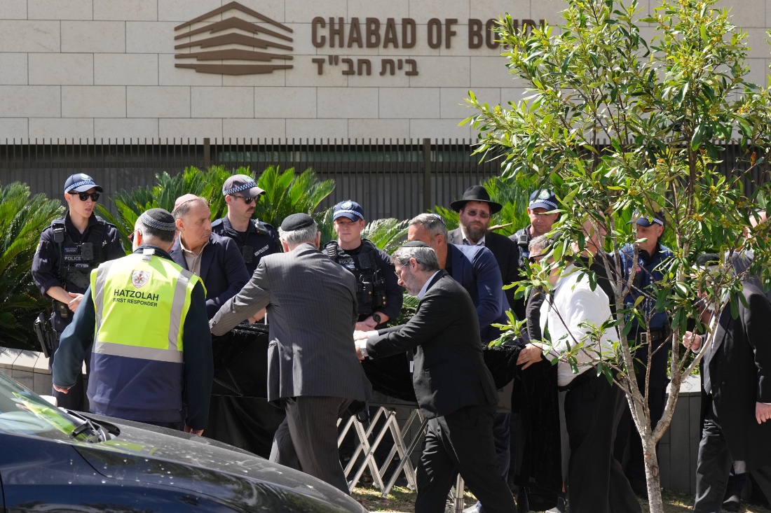 A coffin is wheeled into a synagogue in Bondi in Sydney, Australia. (AP)