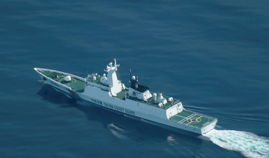 An aerial view of a China Coast Guard ship navigating near the disputed Scarborough Shoal, as Philippine Coast Guard aircraft carrying journalists patrols the area. (Reuters)