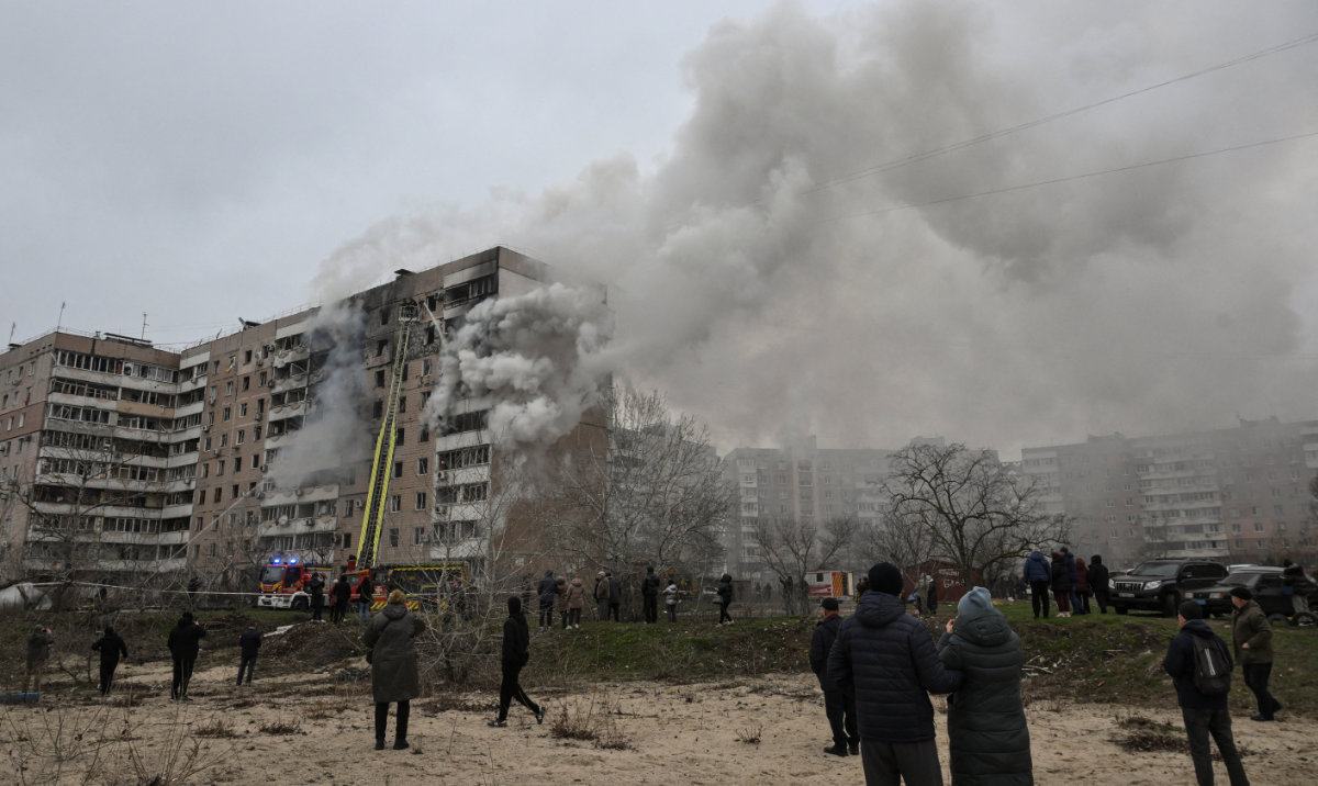 Residents gather in front of an apartment building hit by a Russian air strike, amid Russia's attack on Ukraine, in Zaporizhzhia, Ukraine December 17, 2025. (Reuters)