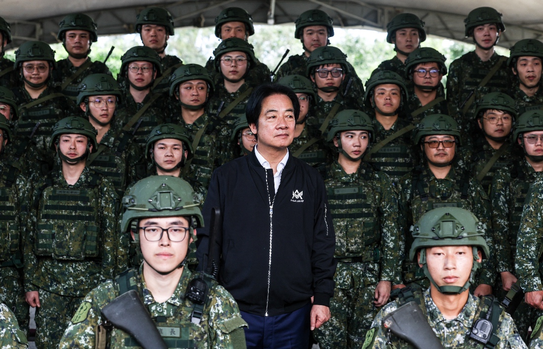 Taiwan President Lai Ching-te prepares to take a group photos with reservists at Loung Te Industrial Parks Service Center, in Yilan County. (AFP)