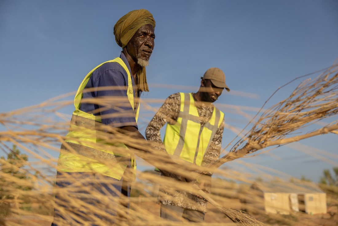 Mbera fire brigade members from the NGO SOS desert demonstrate the brushing technique used to extinguish fires in Mbera Refugee Camp, near Bassikounou, Mauritania. (AP)