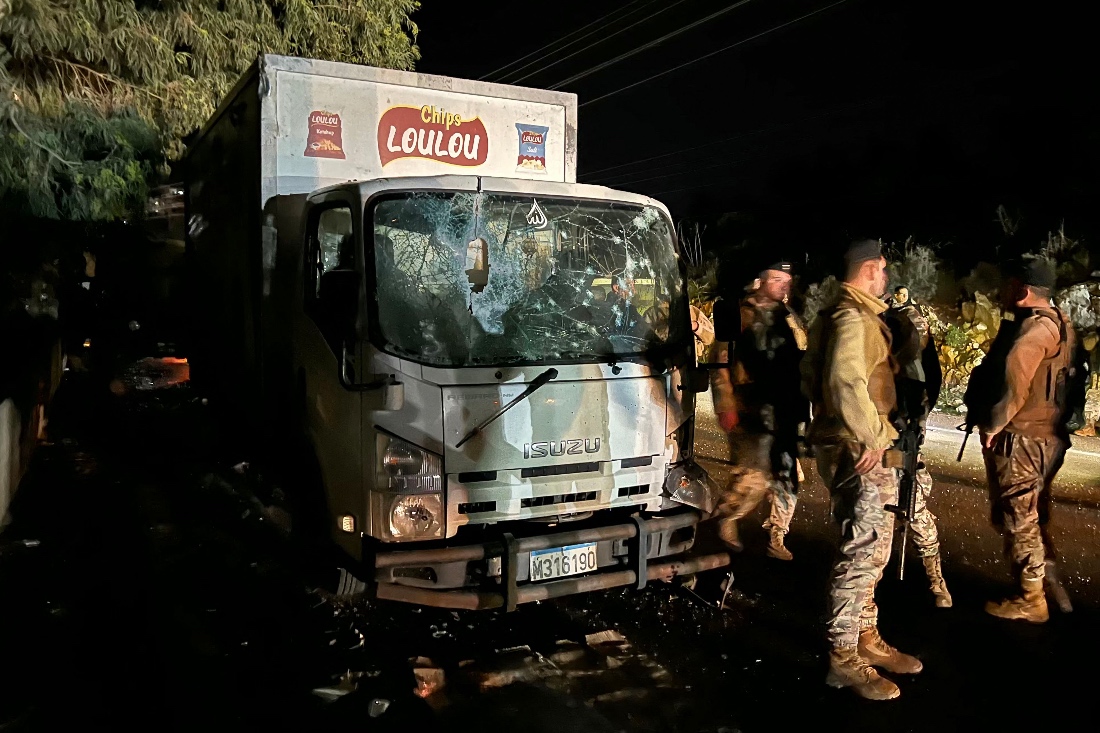 Lebanese soldiers secure the site of an Israeli drone strike that targeted a truck in the village of Jadra, south of Beirut, Lebanon. (AFP)