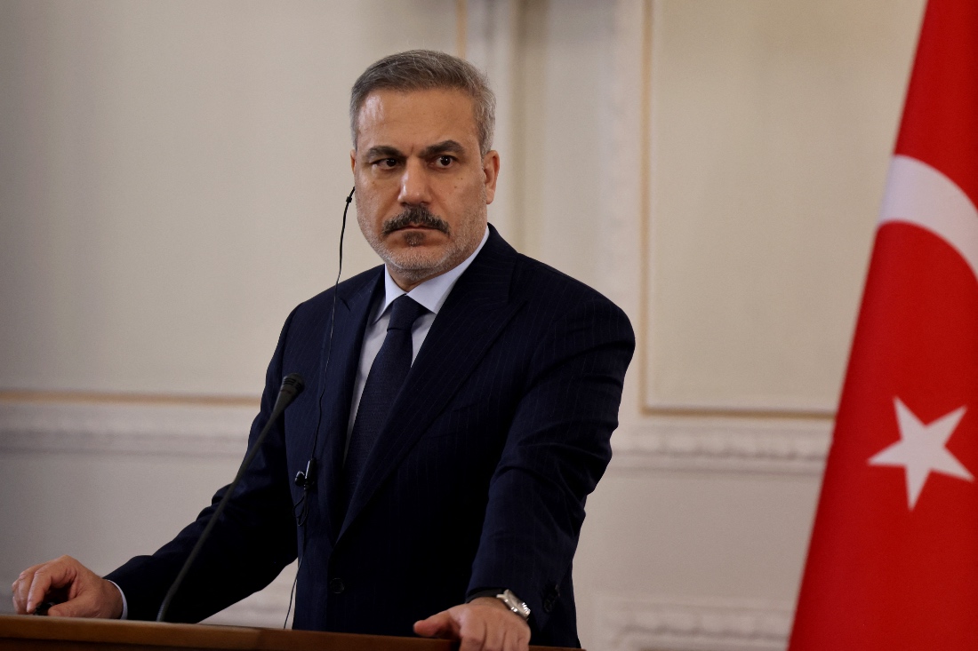 Turkiye's Foreign Minister Hakan Fidan listens to Iran's Foreign Minister during a joint press conference, in Tehran, Iran. (AFP)