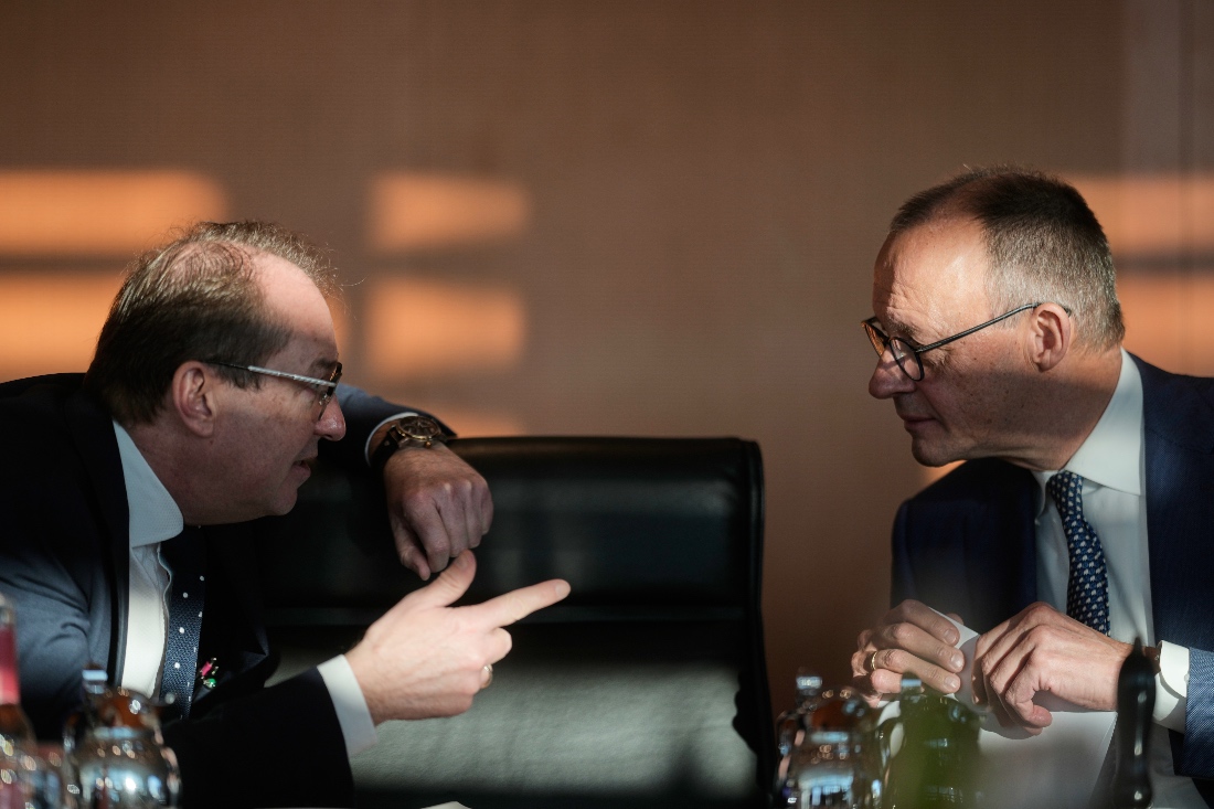 German Chancellor Friedrich Merz speaks with Interior Minister Alexander Dobrindt as he arrives for a cabinet meeting at the chancellery in Berlin, Germany. (AP)