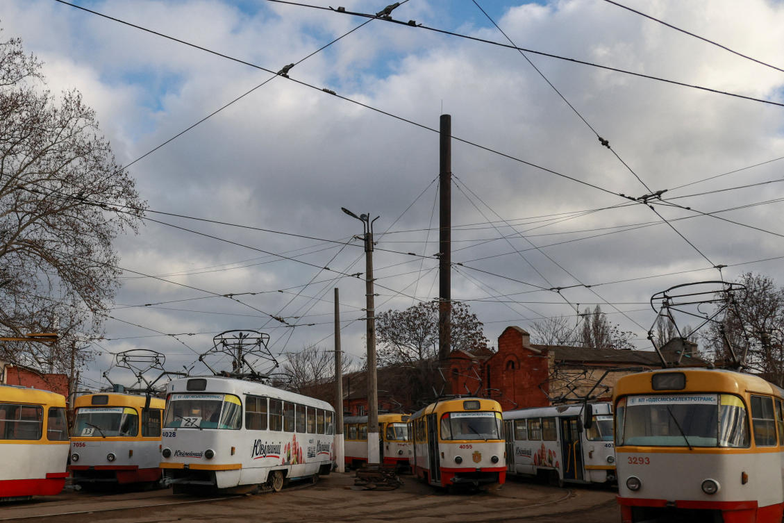 City trams stand in depot during a power blackout after critical civil infrastructure was hit by recent Russian missile and drone strikes, in Odesa, Dec. 17, 2025. (Reuters)