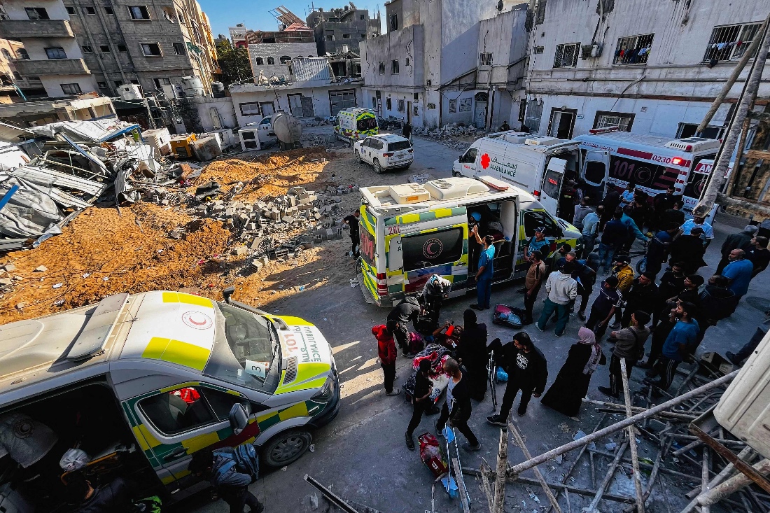 Medics evacuate injured people and cancer patients from the Kamal Adwan Hospital in Beit Lahia in the northern Gaza Strip. (AFP)