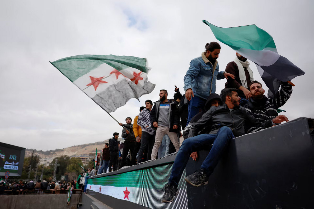 People gather as they celebrate the first anniversary of Bashar al-Assad's fall, at Ummayad Square in Damascus, Syria, December 8, 2025. (REUTERS/File)
