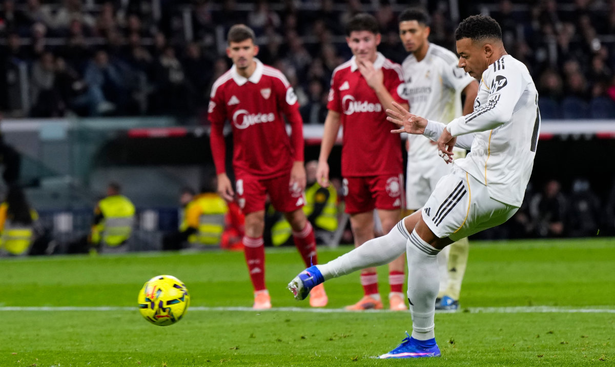 Real Madrid's Kylian Mbappe scores his sides second goal from the penalty sport during the Spanish La Liga soccer match between Real Madrid and Sevilla in Madrid, Spain, Saturday, Dec. 20, 2025. (AP)