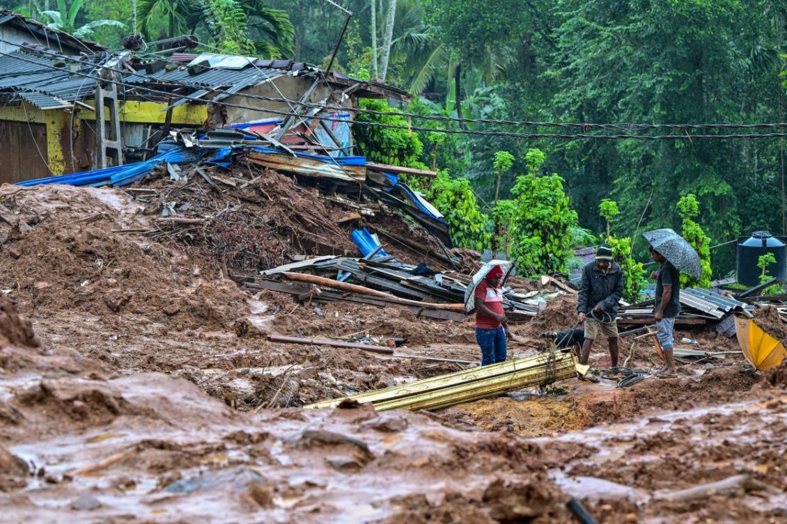 People work near a damaged house at a landslide-affected area in the aftermath of Cyclone Ditwah, in Maspanna on December 13, 2025. (AFP)
