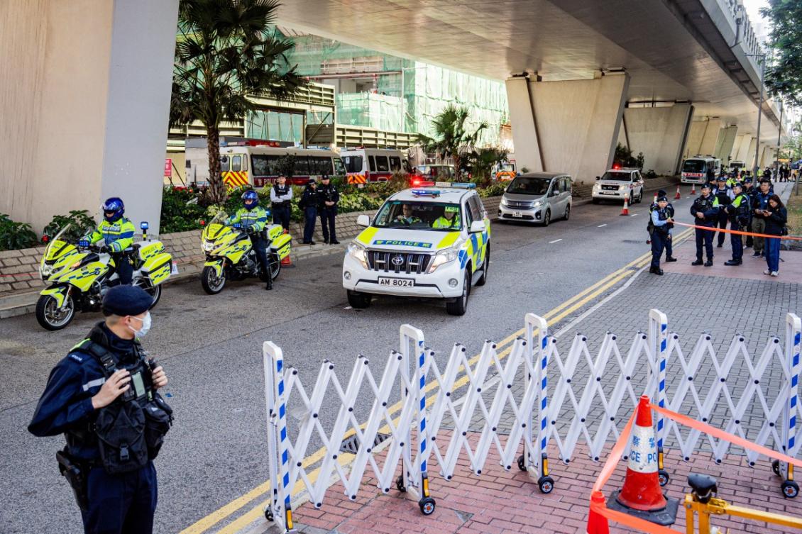 Police are seen outside the West Kowloon court ahead of the verdicts in media tycoon Jimmy Lai's national security trial in Hong Kong on December 15, 2025.(AFP)