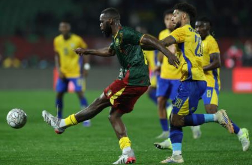 Cameroon’s midfielder #08 Jean Onana gets the ball away from Gabon’s forward #20 Denis Bouanga during the Africa Cup of Nations (CAN) Group F football match between Cameroon and Gabon at Adrar Stadium in Agadir on Dec. 24, 2025. (AFP)