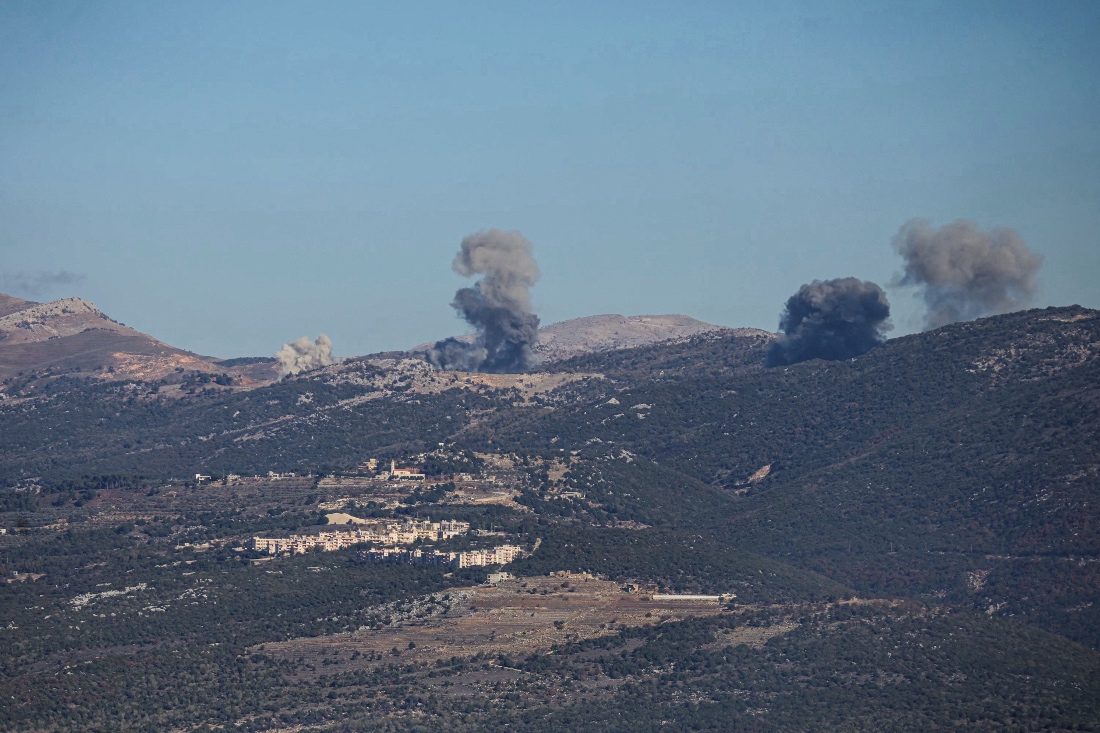 A photo dated December 18 shows smoke rises from the site of a series of Israeli airstrikes that targeted the outskirts of the southern Lebanese village of al-Katran. (AFP)