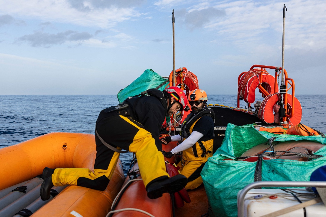 Crew members of the “Ocean Viking” rescue ship take part in a team exercise to prepare for a rescue situation at sea off the coast of Libya, from Augusta, Sicily, southern Italy. (AFP)