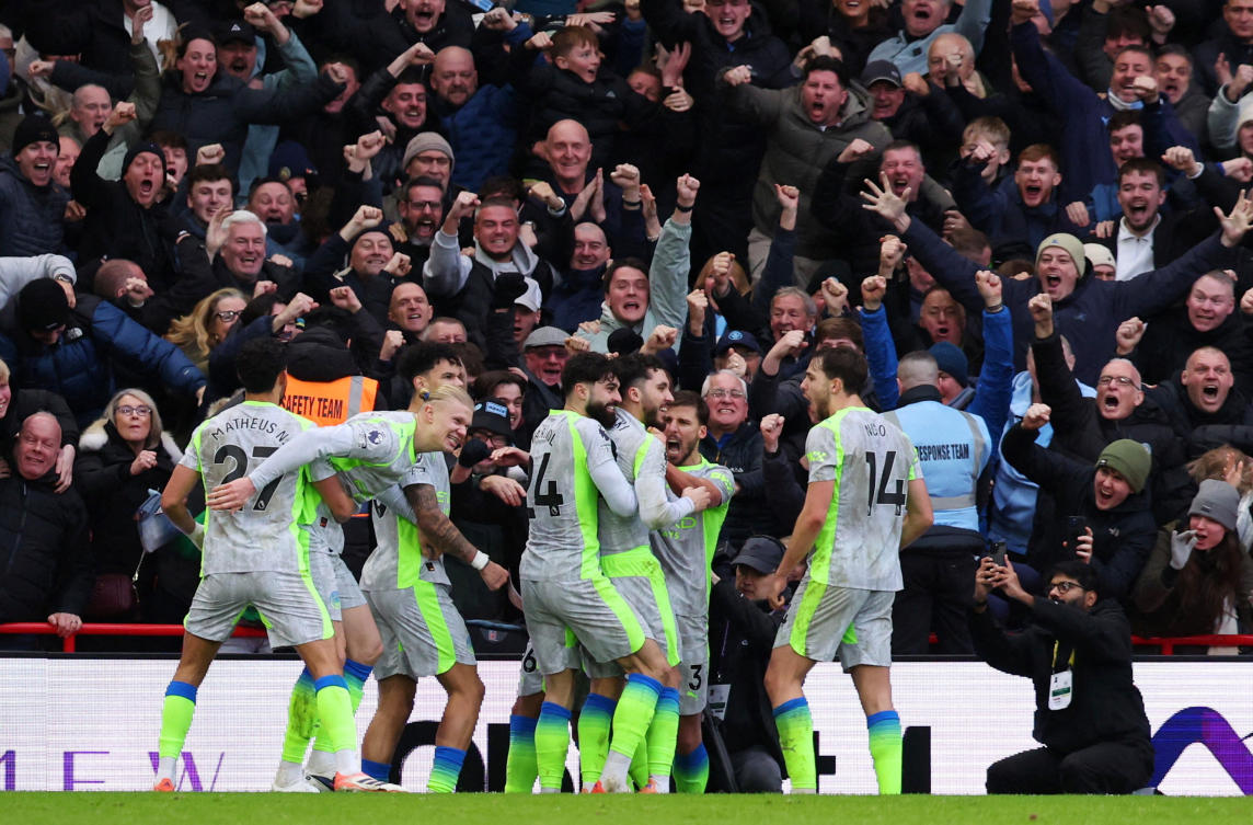 Manchester City’s Rayan Cherki celebrates scoring their second and winning goal with teammates at the City Ground in Nottingham. (Action Images via Reuters)