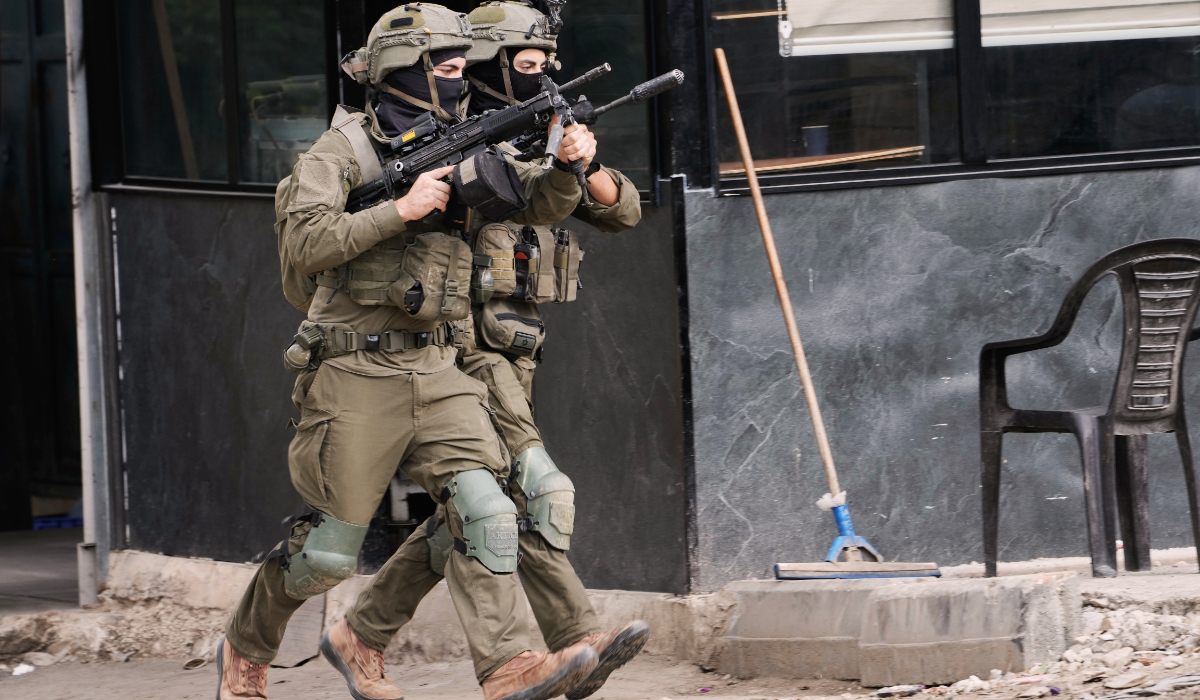 Members of the Israeli forces take positions during a military raid in the West Bank town of Qabatiya, Saturday, Dec. 27, 2025. (AP)