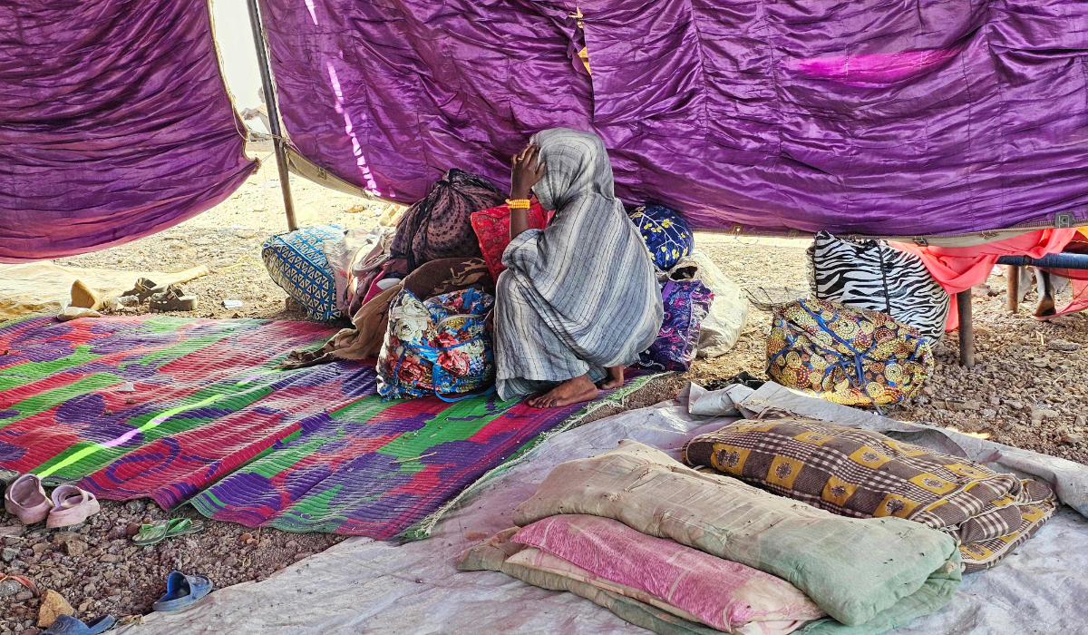 A young displaced Sudanese girl reacts after spending a night with others in Gedaref city eastern Sudan on December 26, 2025 after the Rapid Support Forces (RSF) took control of the Heglig area in western Sudan. (AFP)