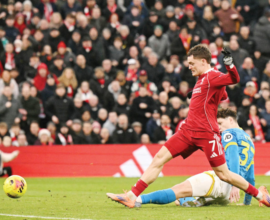 Liverpool’s German midfielder Florian Wirtz scores their second goal during the match between Liverpool and Wolverhampton Wanderers. (AFP)