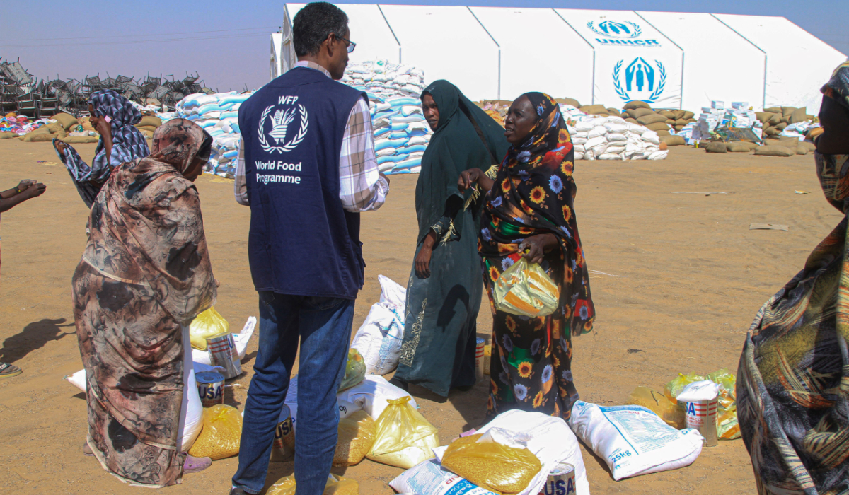 Civilians who fled El-Fasher receive humanitarian aid. (AFP)