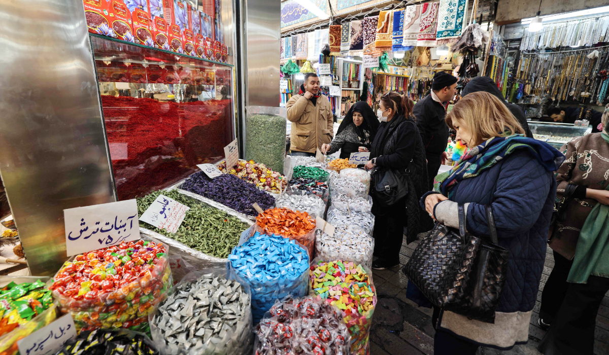 People shop at Tajrish Bazaar in the Iranian capital Tehran on December 29, 2025. (AFP)