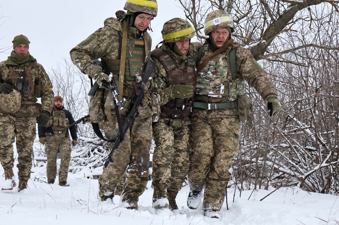 In this photo provided by Ukraine's 65th Mechanized Brigade press service, recruits attend drills at a training ground in the Zaporizhzhia region, Ukraine.
