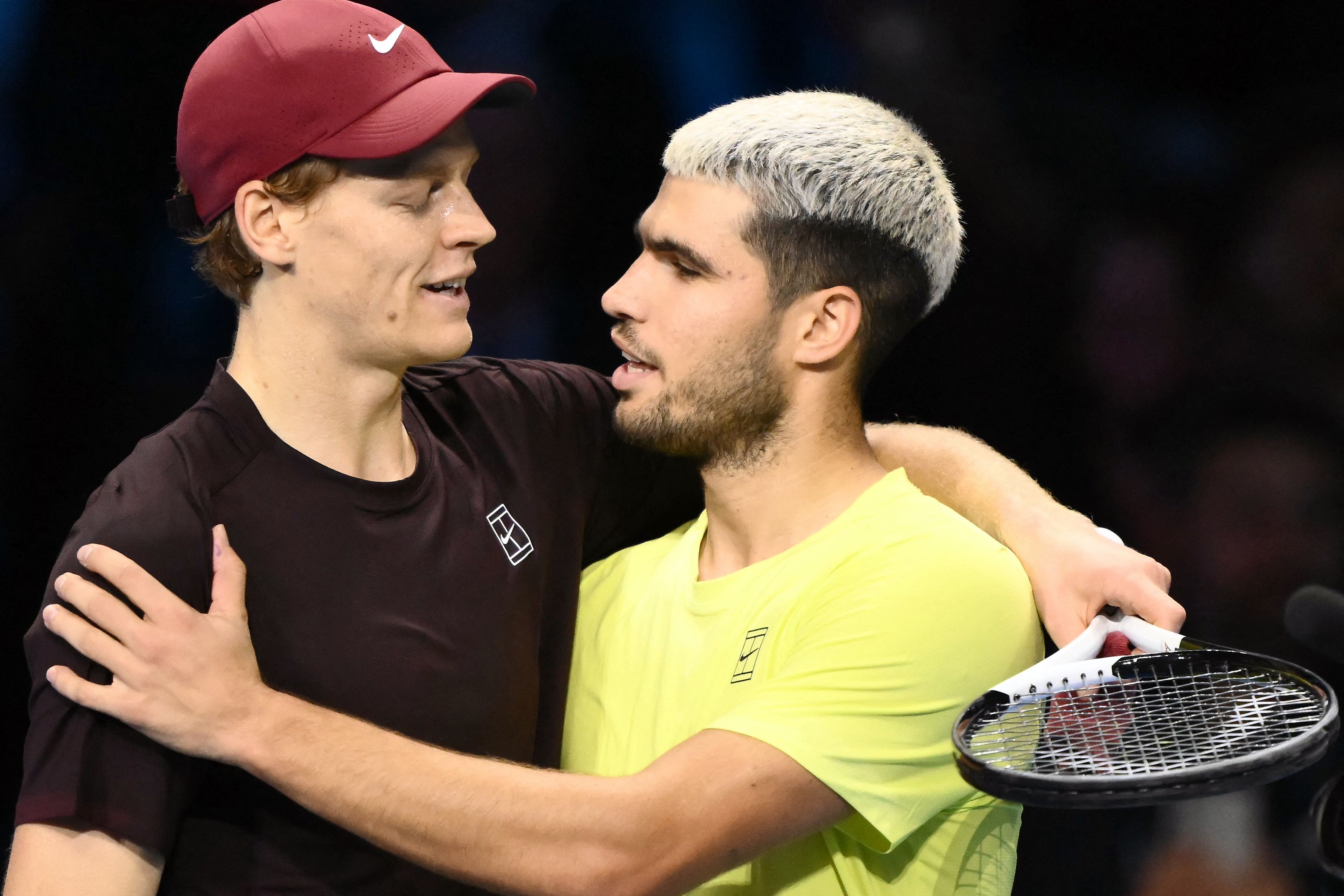 Italy’s Jannik Sinner (L) and Spain’s Carlos Alcaraz at the end of their men's singles final at the ATP Finals tennis tournament, in Turin, on Nov. 16, 2025. Alcaraz and Sinner are gearing up for more world domination in 2026, starting at the Australian Open. (AFP)