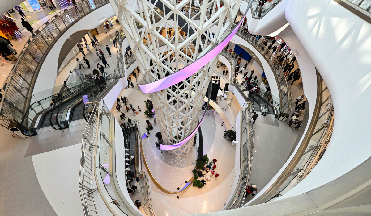 People visit a new shopping mall at the Tongzhou district of Beijing on December 26, 2025. (AFP)