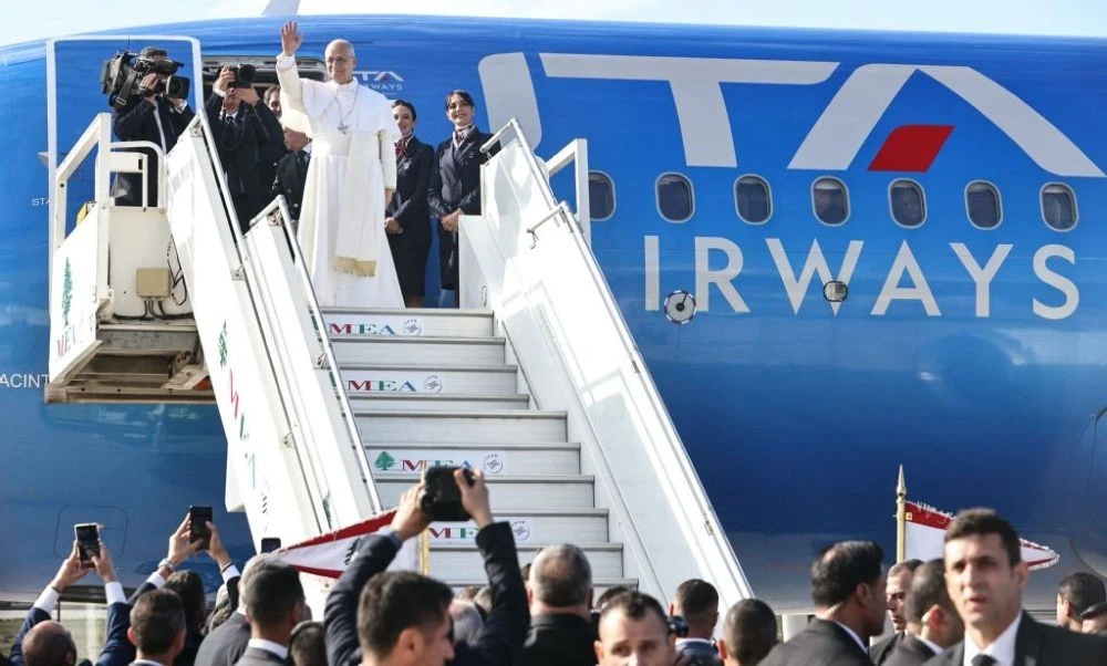 Pope Leo XIV waves, prior to departure, at Beirut International Airport, Dec. 2, 2025. (AFP)