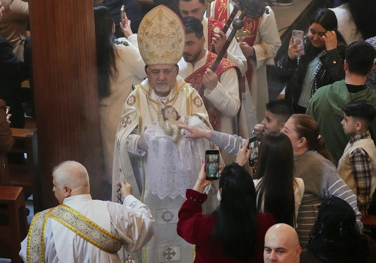 Priest Mokhles Shishah leads prayers during Christmas Eve Mass at Our Lady of Salvation Church in central Baghdad. (AP)