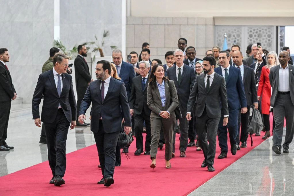 Syrian Minister of Foreign Affairs and Expatriates Asaad Al-Shaibani (front R) arrives to attend a reception with United Nations Security Council delegation at the Presidential Palace in Damascus on December 4, 2025. (AFP)