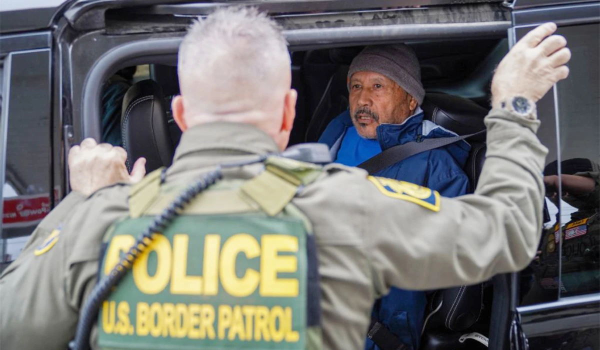 U.S. Chief Border Patrol Agent, Gregory Bovino talks to a detained migrant on December 5, 2025 in New Orleans, Louisiana. (AFP)