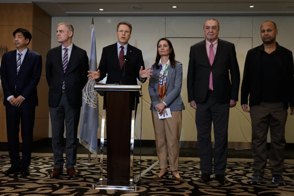Samuel Zbogar, third left, Slovenia's permanent representative to the United Nations and president of the Security Council, delivers a statement with his delegation in Beirut, Lebanon, on Saturday, Dec. 6. (AP)