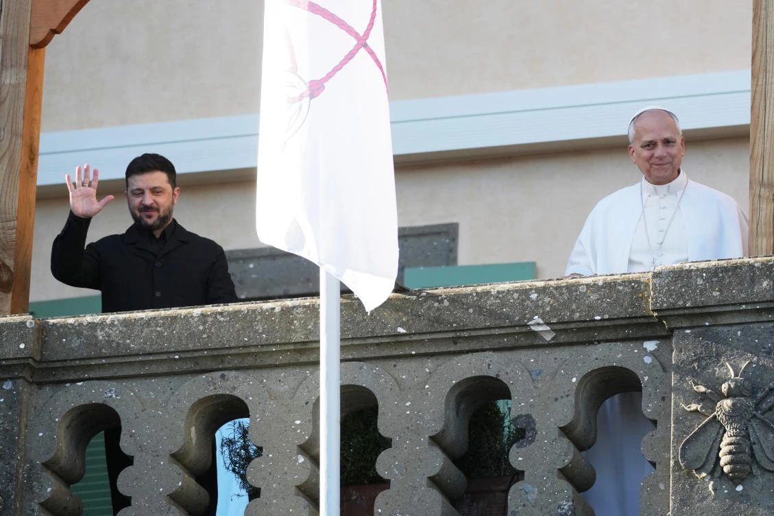 Ukraine President Volodymyr Zelensky and Pope Leo XIV wave to journalists during their meeting in Castel Gandolfo, Italy on Dec. 9, 2025. (AP)