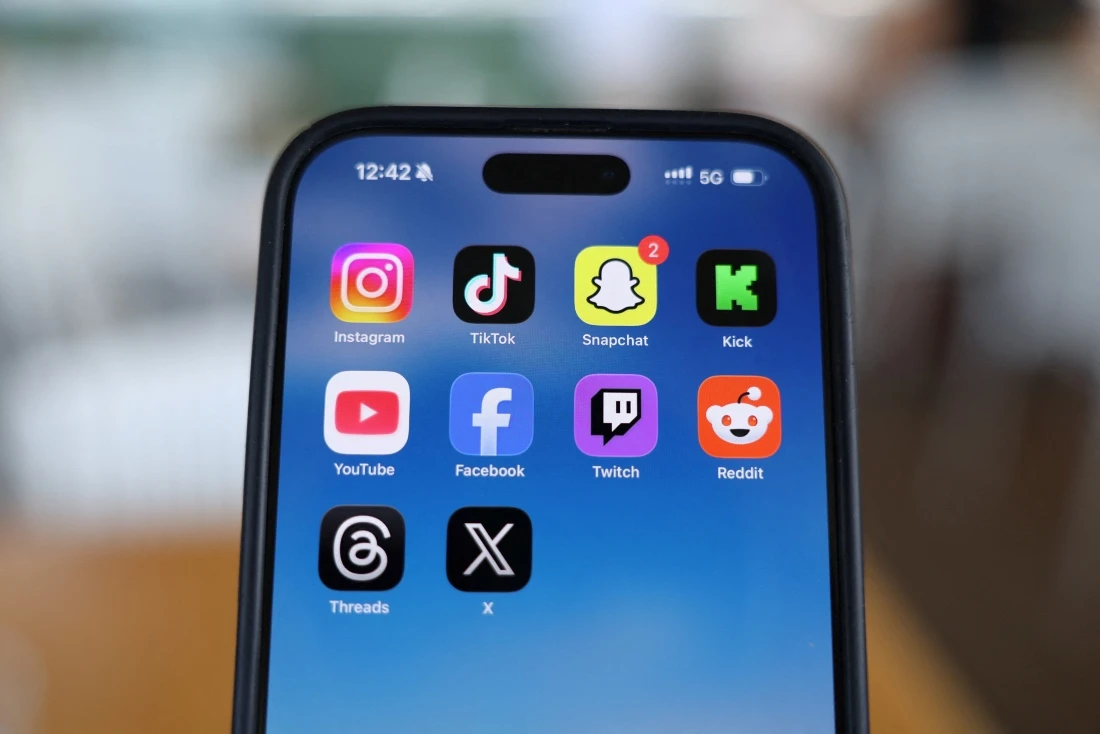 Social media apps appear on a phone. (Reuters)