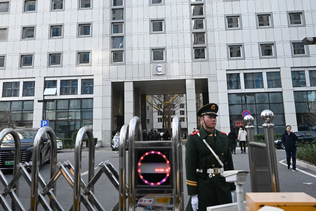 A paramilitary police officer stands guard outside a building of the Foreign Ministry in Beijing, China. (AFP)