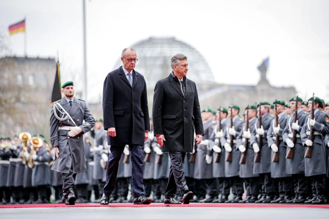 German Chancellor Friedrich Merz welcomes Croatian PM Andrej Plenkovic with military honors in front of the Federal Chancellery in Berlin, Dec. 10, 2025. (AP)
