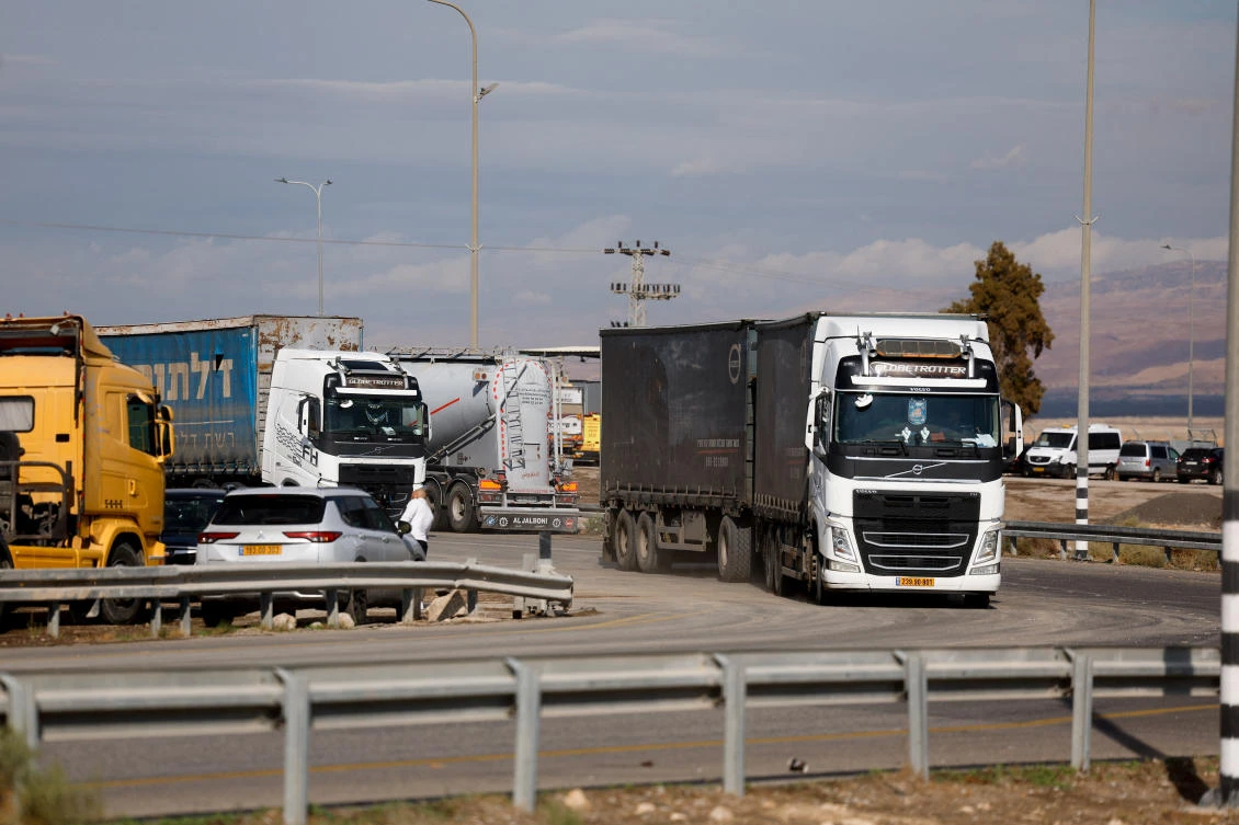 Trucks carrying goods from Jordan, near the Allenby crossing between the occupied West Bank and Jordan. (Reuters)