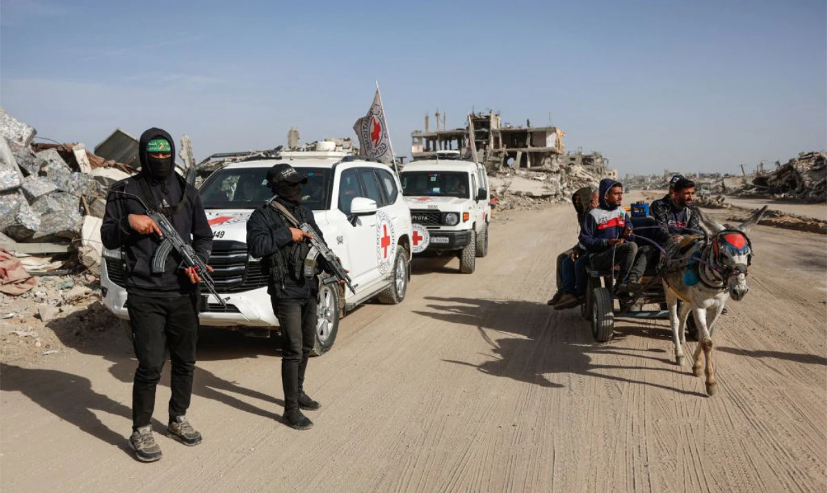 Palestinian Hamas militants secure the area as Egyptian workers accompanied by members of the International Committee of the Red Cross (ICRC) search for the remains of the last Israeli hostage in the Zeitoun neighbourhood of Gaza City on December 8, 2025. (AFP)