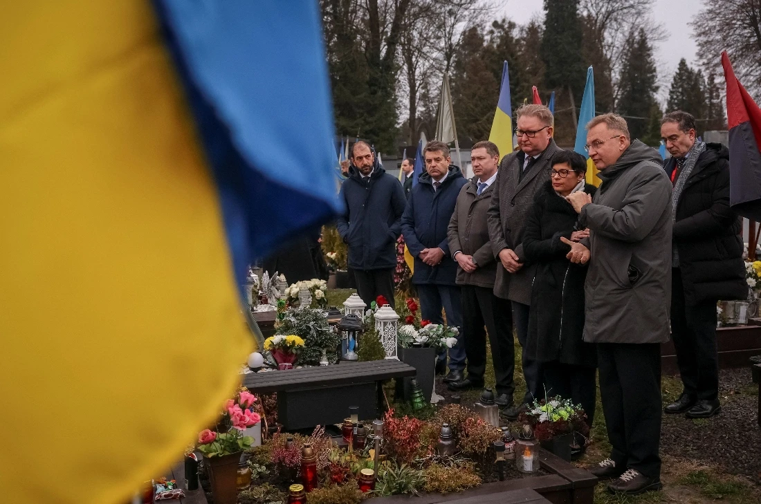 Delegates from European countries attend a commemoration of fallen defenders of Ukraine at a military cemetery in Lviv, Ukraine. (AFP)