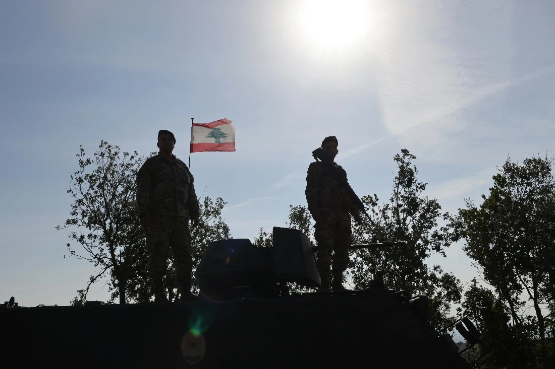Lebanese soldiers standing atop a military vehicle in Alma Al-Shaab, near the border with Israel in southern Lebanon. (AFP)