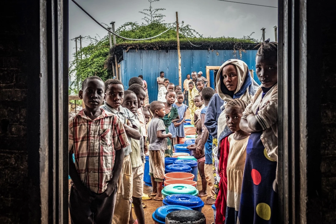 Refugees from eastern Democratic Republic of the Congo at a food distribution point at Nyarushishi Transit Camp in Rusizi district, Rwanda. (AFP)