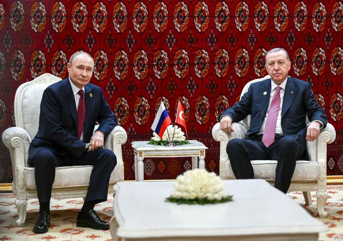 Russian President Vladimir Putin and Turkish President Recep Tayyip Erdogan attend a meeting on the sidelines of an international forum in Ashgabat, Turkmenistan. (AP)