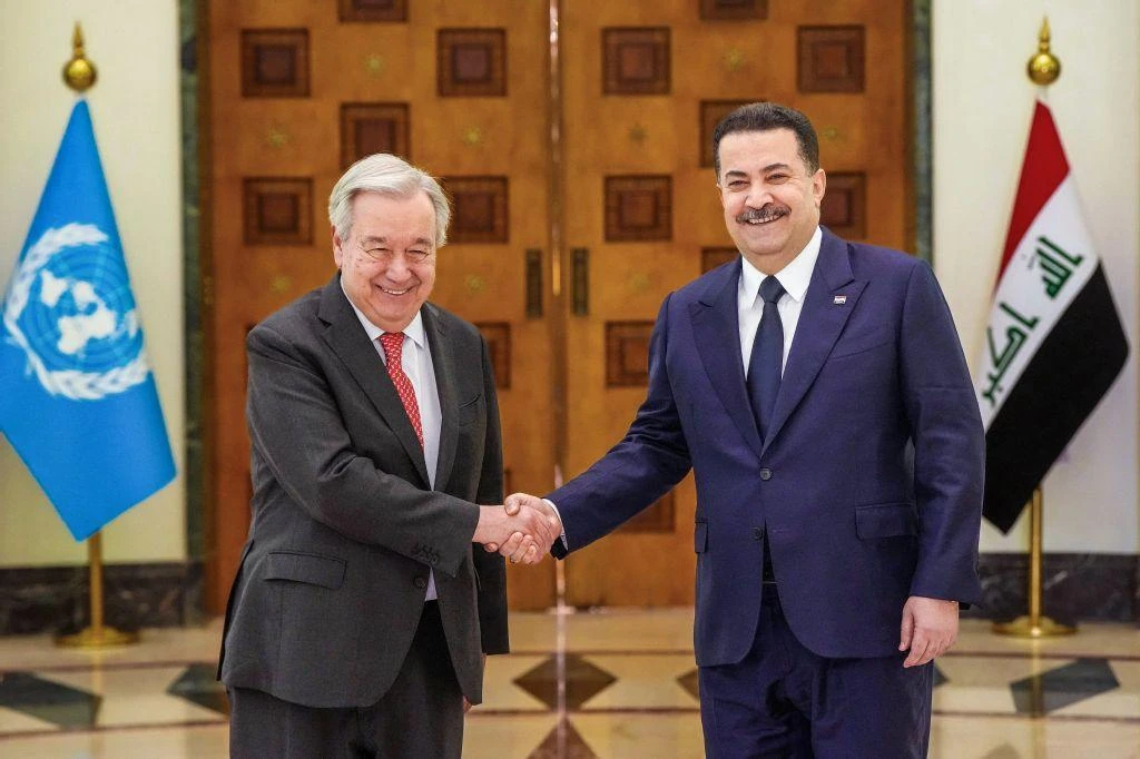 This handout picture released by the office of Iraq’s Prime Minister Mohammed Shia Al-Sudani on Dec. 13, 2025, shows him shaking hands with UN Secretary-General Antonio Guterres during a meeting in Baghdad. (AFP)