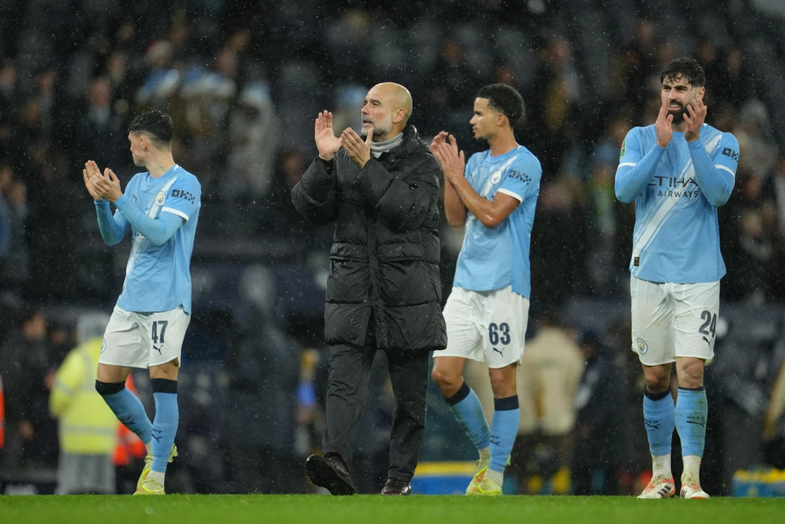 Manchester City’s head coach Pep Guardiola and players applaud fans after their English League Cup match against Brentford in Manchester, Dec. 17, 2025. (AP)