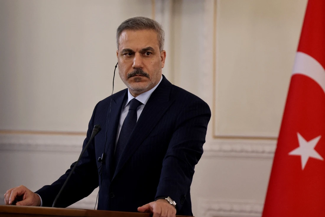 Turkiye's Foreign Minister Hakan Fidan listens to Iran's Foreign Minister during a joint press conference, in Tehran, Iran. (AFP)