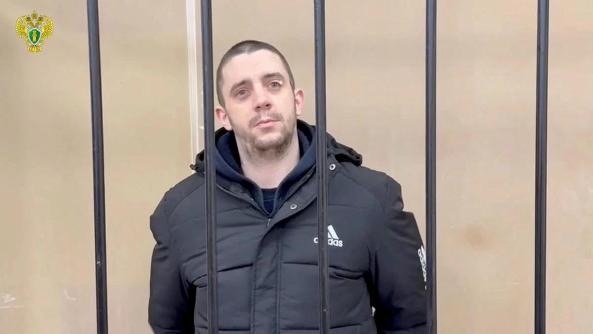 The defendant named by the office of Russia’s Prosecutor General as Hayden Davies, a 30-year-old British citizen convicted of being a paid mercenary fighting for Ukraine against the Russian army amid the military conflict, attends a court hearing in Donetsk, on Dec. 18, 2025. (Reuters)