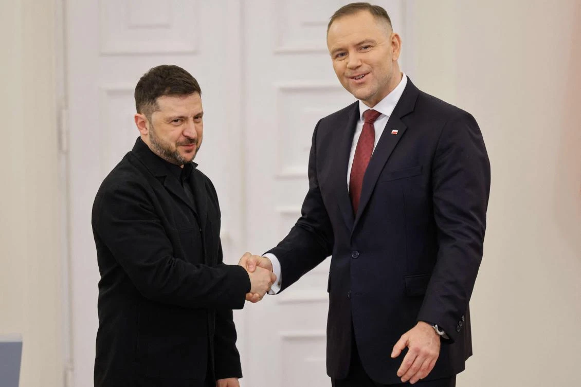 Poland’s President Karol Nawrocki and Ukraine’s President Volodymyr Zelensky shake hands at the end of a joint press conference following their talks at the Presidential Palace in Warsaw, Poland, on Dec. 19, 2025. (AFP)