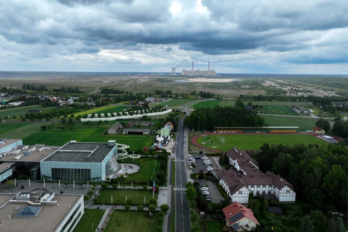 This aerial photograph taken on May 29, 2025 shows a view of the village of Kleszczow with the Belchatow coal mine and power plant in the background. (AFP)