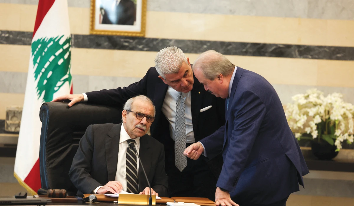 Lebanese Prime Minister Nawaf Salam speaks with Finance Minister Yassine Jaber and Lebanese Industry Minister Joe Issa El-Khoury in Beirut on Tuesday. (Reuters)