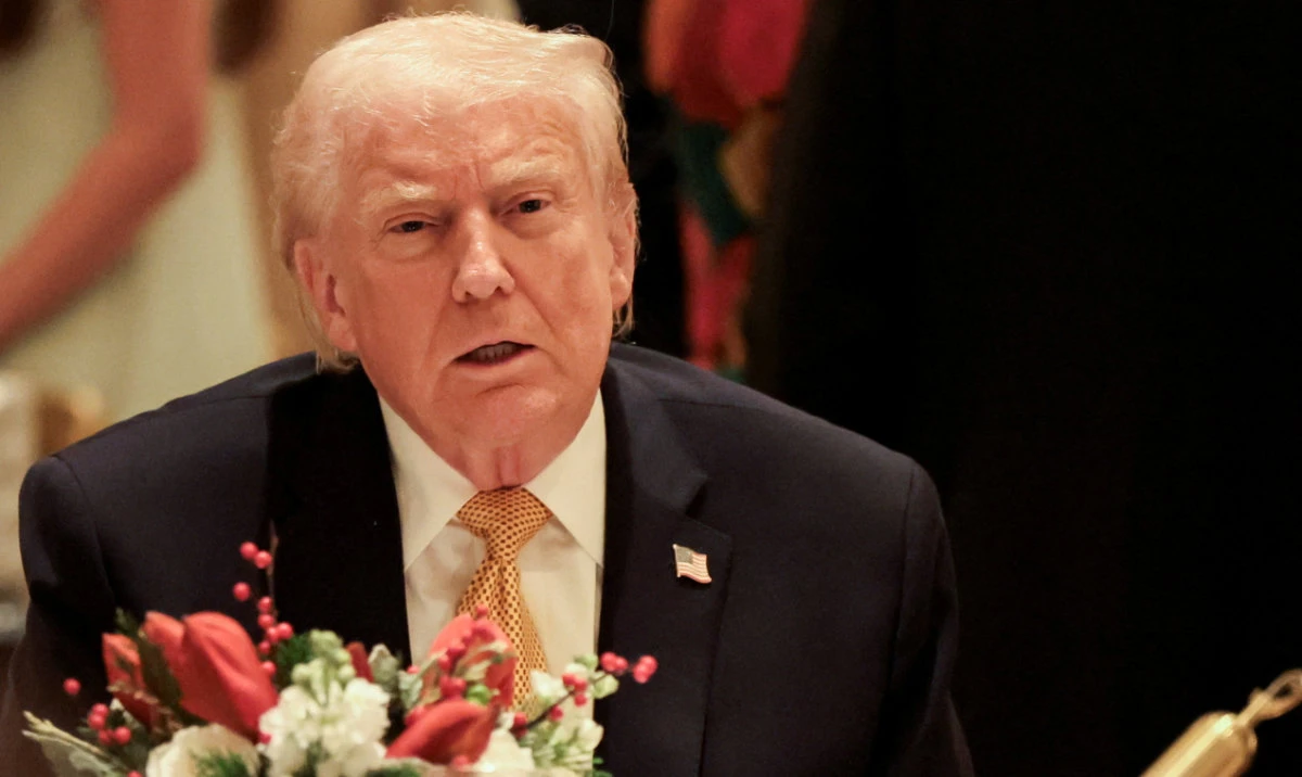 US President Donald Trump takes part in a Christmas Eve dinner in the ballroom of his Mar-a-Lago club in Palm Beach, Florida, US, December 24, 2025. (Reuters)